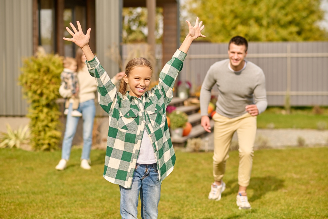 leisure-smiling-school-age-girl-plaid-shirt