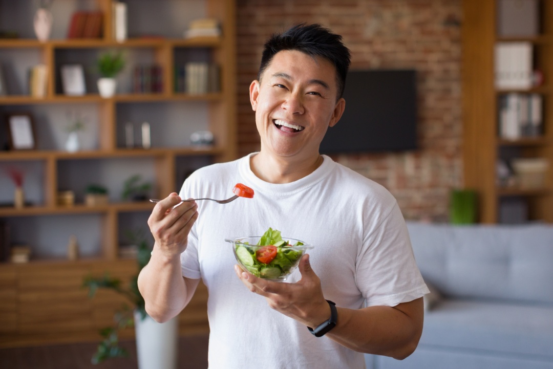 happy-man-eating-nutrition-food