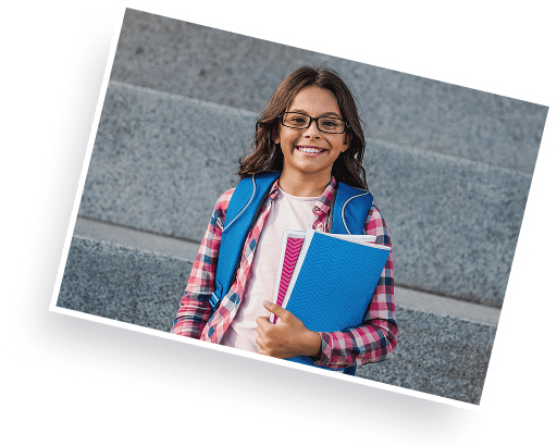 girl with eyeglasses smiling holding books